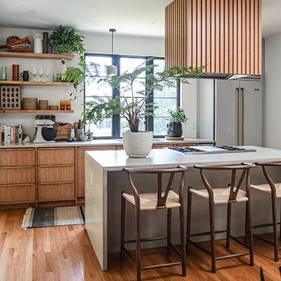 Hilton Carter after image of kitchen with natural wood and modern black details