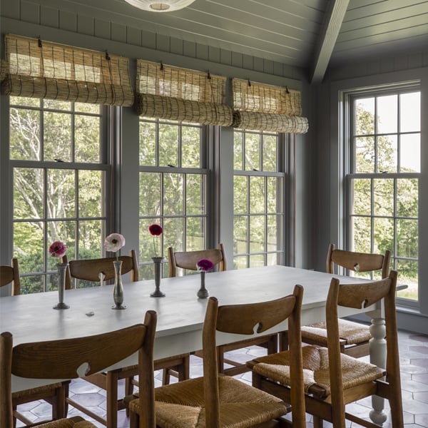 cottage style sunroom with double hung windows with grilles
