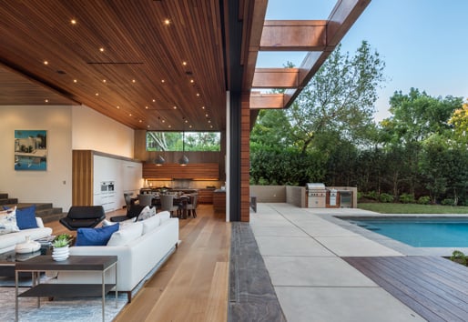 Indoor/outdoor living with wide opening leading to pool